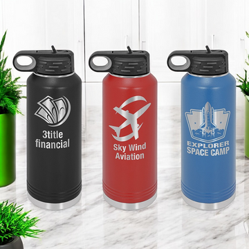 Custom logo engraved 40 oz insulated water bottles in multiple colors, ideal for corporate gifts and promotional branding events.