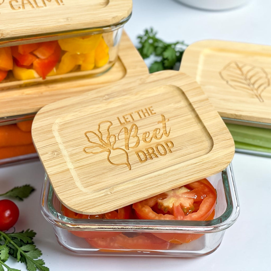 Funny engraved glass food storage container set with bamboo lids featuring playful kitchen pun sayings and eco-friendly reusable storage containers. Stylish kitchen organization set ideal for realtor closing gifts, modern housewarming gifts, and personalized kitchen gifts for new homeowners.