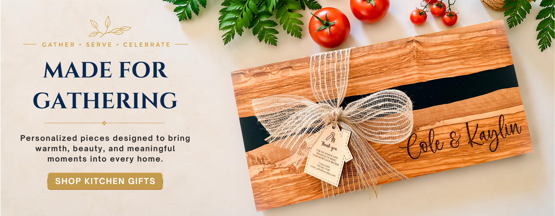 Luxury kitchen gifts and entertaining banner featuring a personalized olive wood charcuterie board with black resin detail, styled with fresh tomatoes, greenery, and wooden serving utensils on a warm cream background. Elegant editorial design for personalized kitchen gifts, realtor closing gifts, housewarming gifts, and entertaining essentials.slider_item_KTGWDH