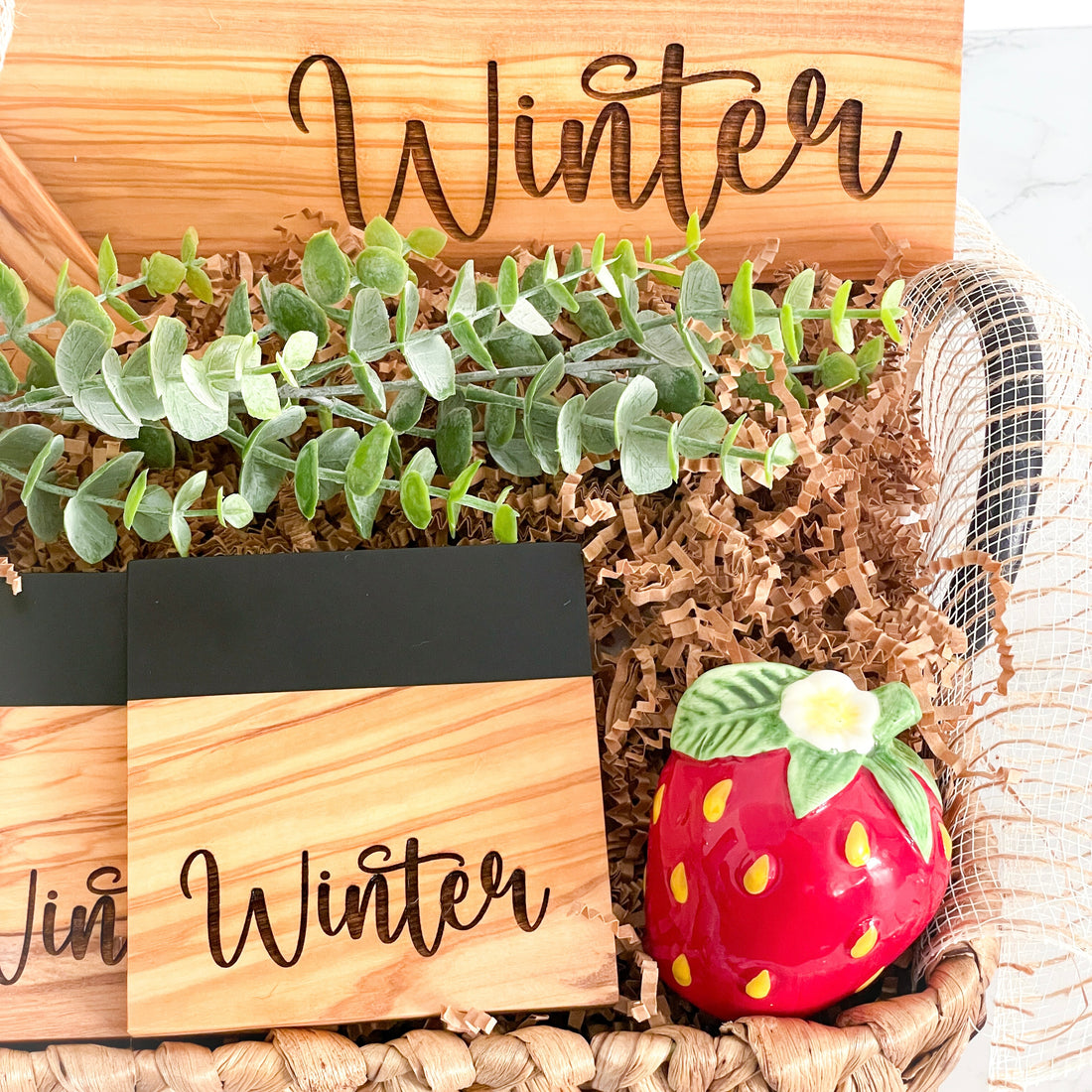 Luxury personalized black river resin and olive wood cutting board gift basket for realtors, home buyers, and housewarming gifts. Includes engraved coasters and personalized serving spoons.