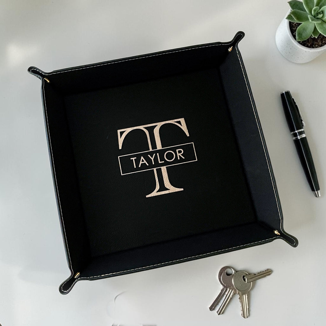 Luxury personalized closing gift basket with blue resin olive wood serving board, engraved leatherette coasters, keychains, candle, and vanity tray designed for realtor closing gifts and upscale housewarming presents