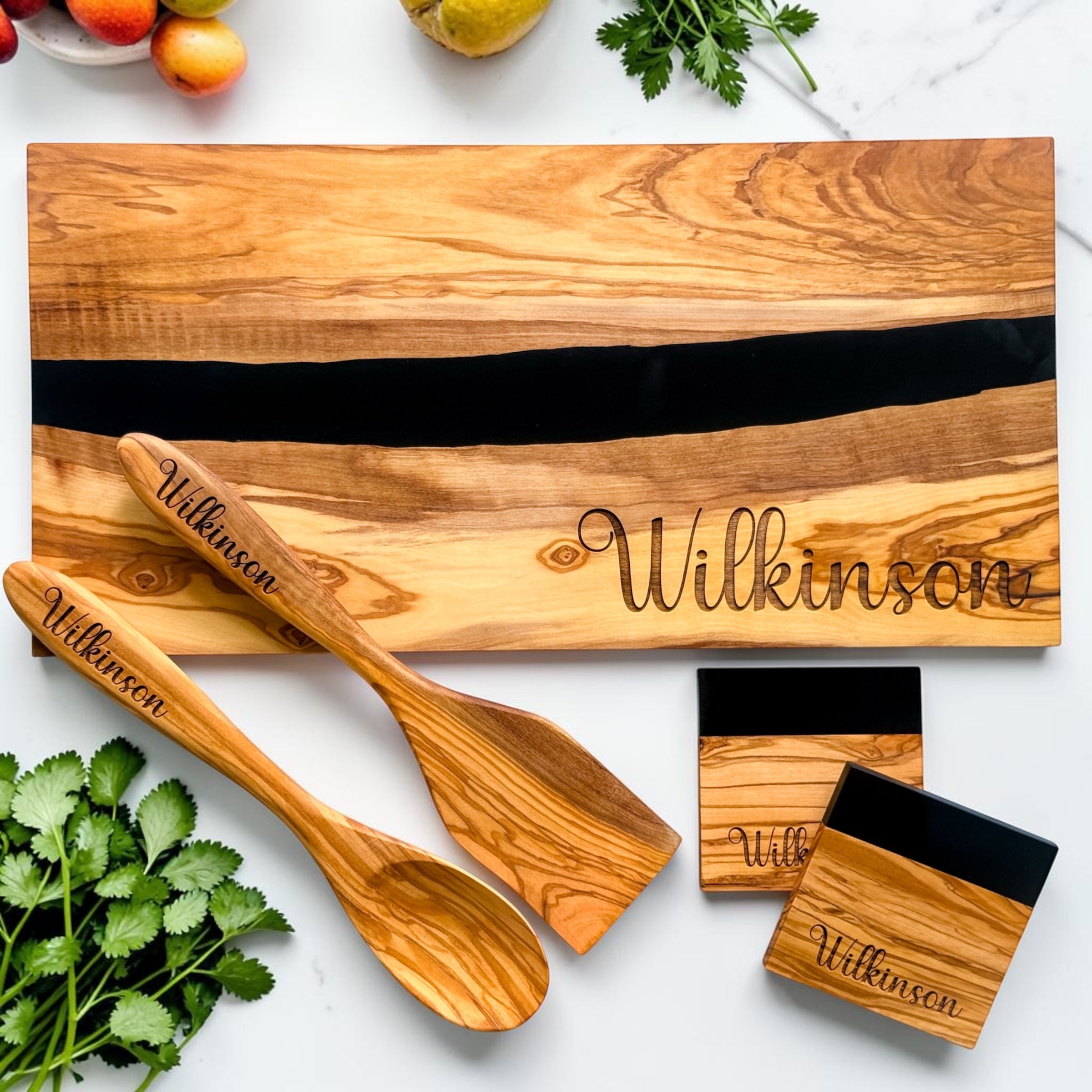 Luxury realtor client appreciation gift set featuring personalized olive wood and black resin serving board with engraved utensils and matching coasters