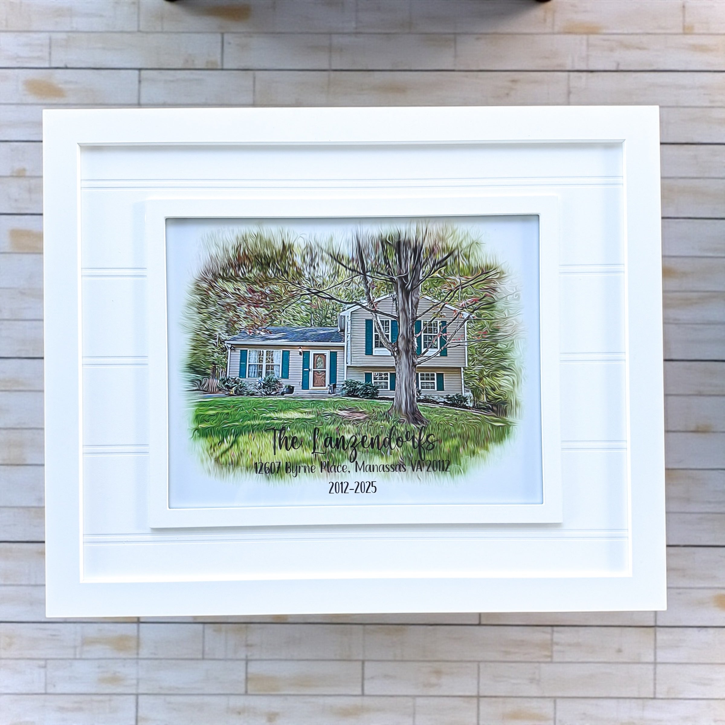 Custom framed digital oil painting style house portrait personalized with family name and address displayed in white beadboard frame for realtor closing gifts and housewarming gifts